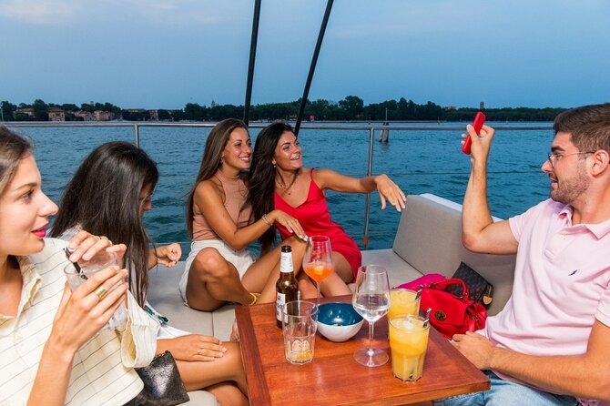 Venice by Night Catamaran Cruise - Live sax and bar toast: the onboard mood that makes it worth it