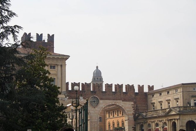 Verona City Sightseeing Walking Tour of Must-See Sites with Local Guide - Dante’s Square (Piazza dei Signori): the mood shifts—and so does the story